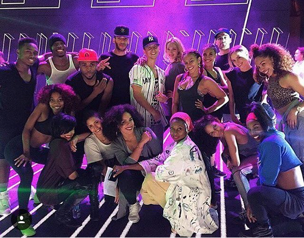 Ashley Cruz performing with major artist